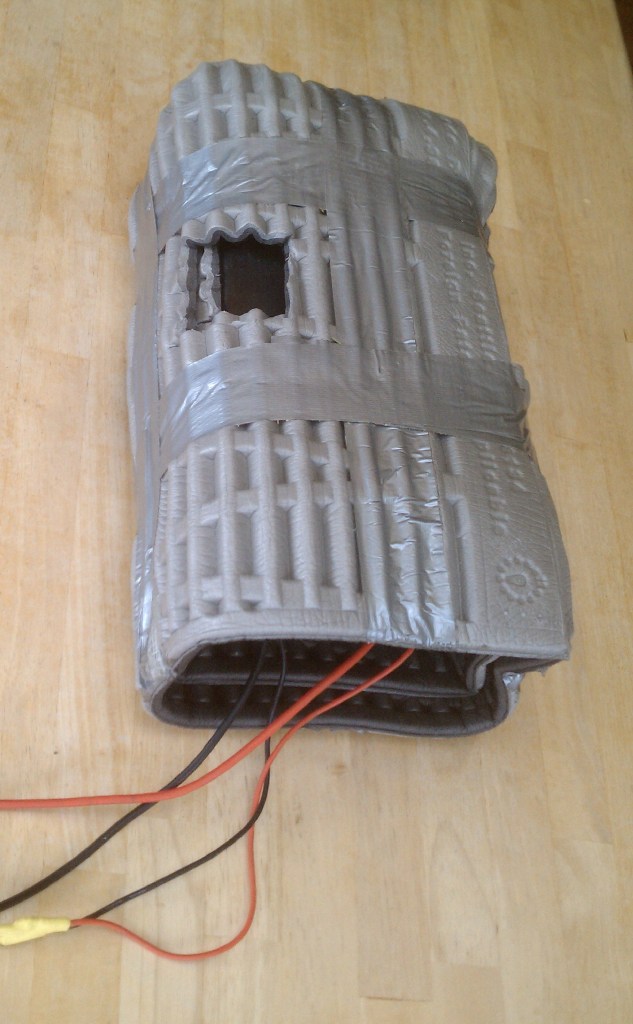 Looks like crap but it works. Holes cut for cooling and 2 layers of thermarest. 