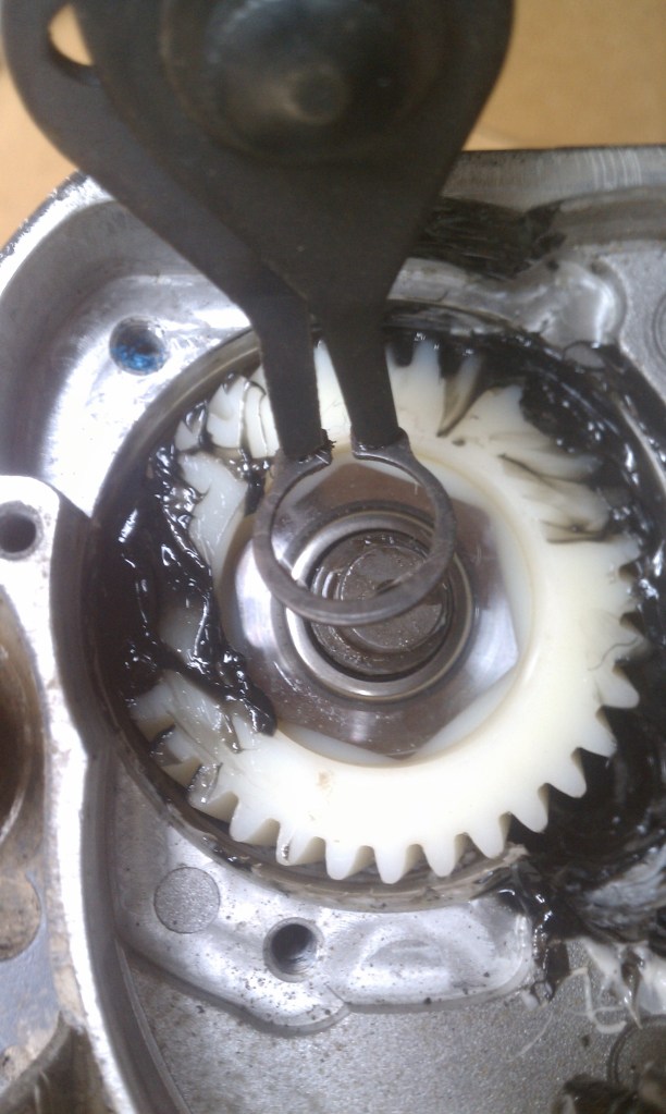 Use the lockring plyers to remove the lockring then the nylon gear slides right out.
